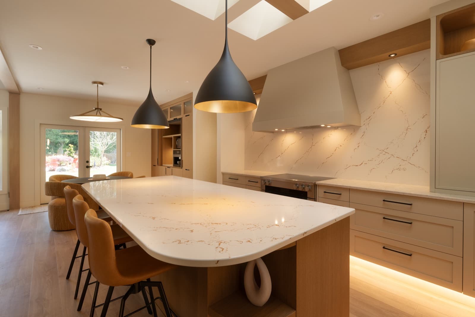 Cabinet hardware beside the veined stone work surface.